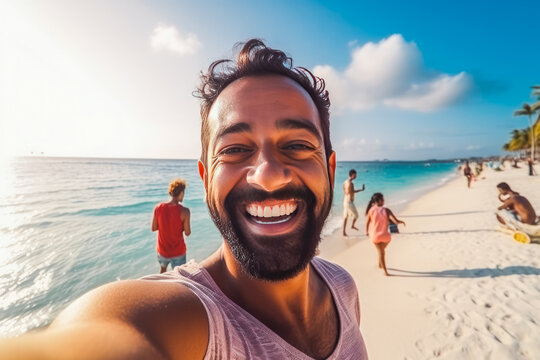 Happy young indian man enjoying a day on the beach while smiling and making a picture