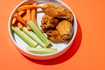 Chicken Wing Dinner Plate with Side of Carrots and Celery