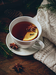 Cup of hot tea with orange and spices for winter and Christmas  time - 641874665