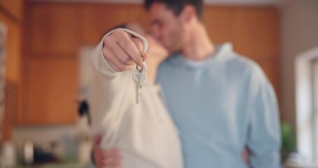 Couple, hands and kiss with keys in new home for moving together, property investment or real estate dream. Closeup, man and woman celebrate key to house building, financial security or mortgage loan