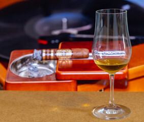 Interesting single malt scotch whiskey in tasting glass with distinctive and unusual background