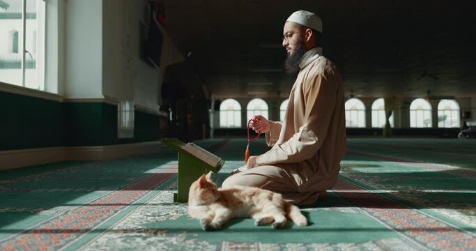 Quran, islamic and man with faith in a mosque for praying, peace and spiritual care in holy religion for Allah. Reading book, Ramadan and Muslim person with beads, hope or grastitude to worship God