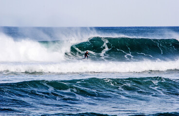 Surfer surfing the sea of Spain, with a beautiful tube. Presence of water splashes. Mundaka, Spain....