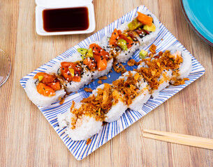 National dish of Japanese cuisine is Uramaki rolls and Saketaki rolls made from crabs, avocado,...