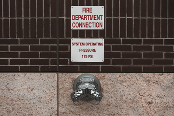 Fire hydrant water pipe, mounted in a building wall. Manhattan USA. High quality photo