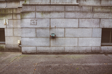 Fire hydrant water pipe, mounted in a building wall. Manhattan USA. High quality photo