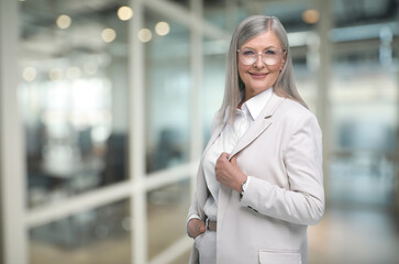 Portrait of confident woman on blurred background, space for text