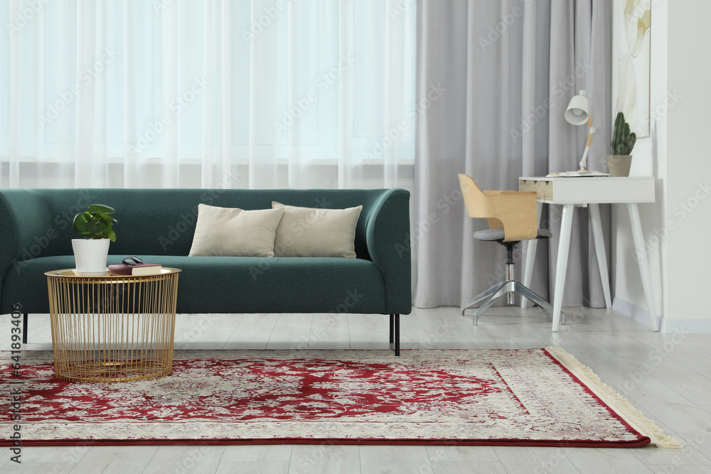 Poster Stylish living room with beautiful carpet and furniture. Interior design