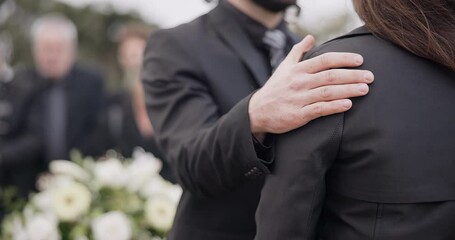 Funeral, support and people care for grief, mourning or depressed mother at burial ceremony, memorial service or cemetery. Hand, shoulder and man helping sad woman with love, advice or family comfort