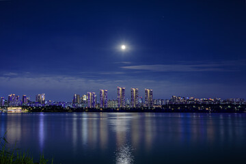 Fototapeta na wymiar moonlit river, cityscape in night, seoul, hanriver