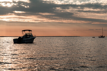 sun set and shadows of boats on a ocean in summer. High quality photo