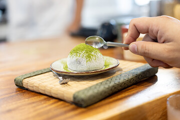 Green Tea Daifuku Dessert on aTatami mat serving on Wooden Table
