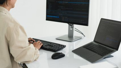 Developer programmer programming code to developing website and application in software office