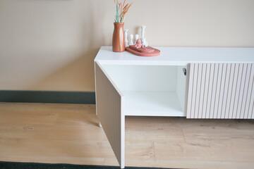 a open and empty tv cabinet at home 