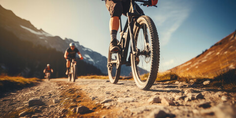 Group of cyclists descends a slope on their mountain bikes. 