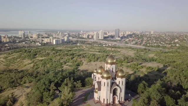 Soaring down above All Saints Church in an aerial shot over the Mamayev Kurgan in Volgograd, Russia.