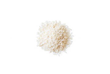 Closeup of a pile of organic basmati rice isolated on a white background from above, top view
