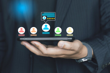 Concept Testimonial and customer feedback online, People touch smartphone with popup of five star and user feedback on screen.