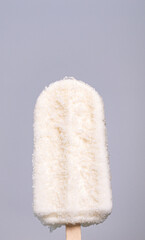 Vertical front view CU, Coconut milk flavored ice cream sticks on a white background.
