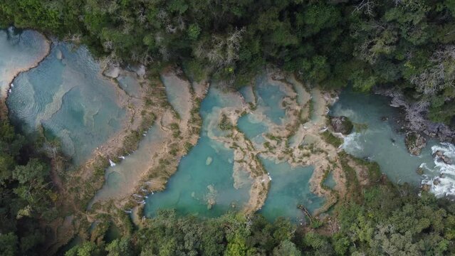 Straight down aerial of Semuc Champey river dam waterfalls, Guatemala
