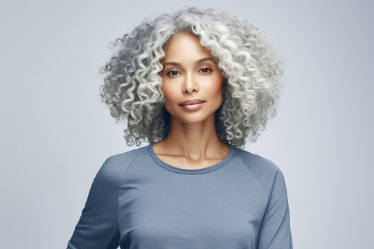 Multicultural Young Woman With Curly White Hair In A Studio Shot