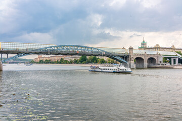 Fototapeta na wymiar View of the Moscow river embakment, Pushkinsky bridge and cruise ships at sunset.