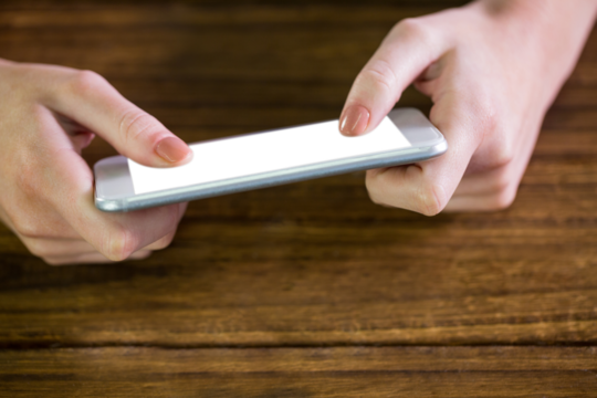 Digital png photo of caucasian woman using smartphone with copy space on transparent background