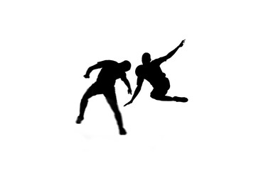 Fototapeta na wymiar Digital png illustration of silhouettes of male american football players on transparent background