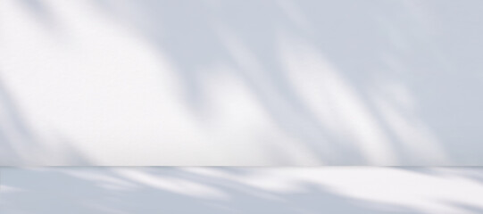 Fototapeta premium Panoramic view of empty table counter with sunlight and branch shadow on white cement wall room background, suitable for product mockup Display Presentation
