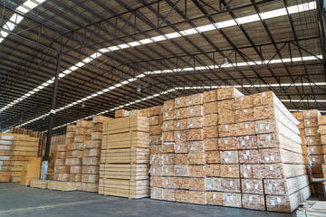 Pile of lumber in wooden warehouse storage. Pile of timber at warehouse storage. Pile of pallet in warehouse