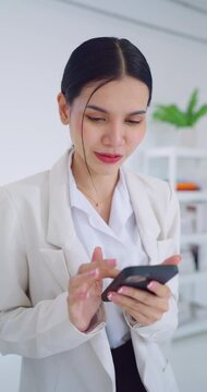 Beautiful business woman using phone to contract with customer at office. Business, Conection, Massage, Lifestyle, Technology, Communication and Marketing concept.