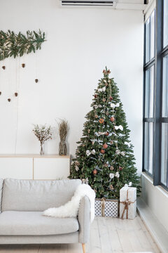 Beautiful interior of living room with decorated Christmas tree