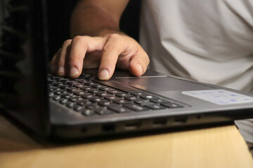 man hand using computer laptop