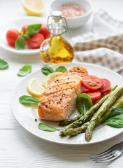 Baked Delicious salmon, green asparagus on  plate