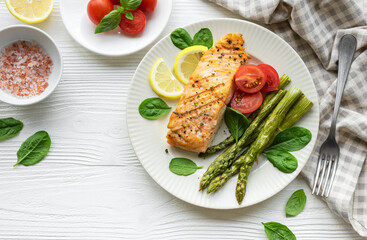 Baked Delicious salmon, green asparagus on  plate