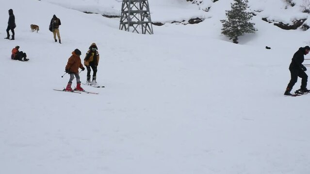 A person skiing in the snowy mountains, auli, uttarakhand, india.
