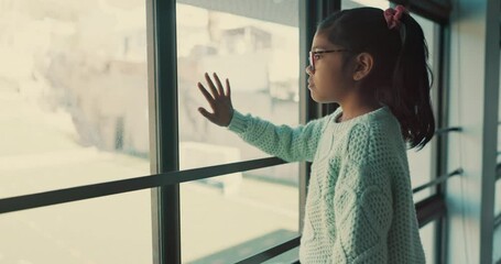 Hand, window and girl child with depression, anxiety or fear, terror or kidnap danger in a house. Mental health, stress and kid with anxiety from abuse, bullying or trauma, crisis or abandoned