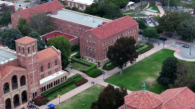 Aerial Flying Past Dickson Court At UCLA With Students Outside The Royal Hall Building. Dolly Right