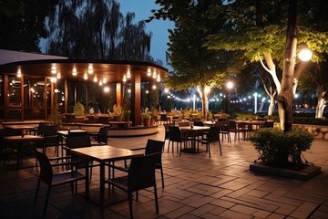 Luxury restaurant with tables and chairs in the evening. Restaurant exterior