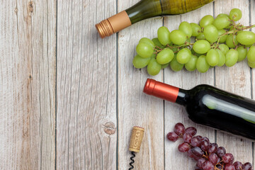 Chilean wine, national day. Air view, bottle of white and red wine, on wooden table, corks. With space for copy