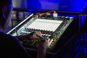Hands on mixing console in music recording studio - obrazy, fototapety, plakaty