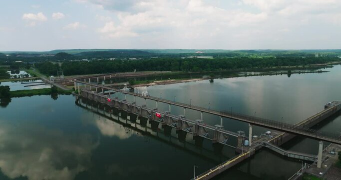 Big Dam Bridge With Mirror Reflections Over Arkansas River Near Cook's Landing Park In North Little Rock, Arkansas, USA. Aerial Shot