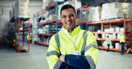 Engineering, crossed arms and face of man in a warehouse for inventory, stock check or distribution. Industry, smile and young Mexican male industrial worker with confidence at a logistics factory.