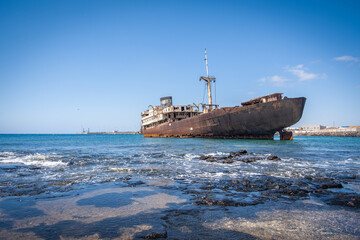 Ship stranded on the coast of Arrecife in Lanzarote, called Telamón. Rusty boat. Stranded ship....
