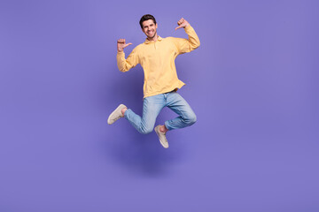 Full length body photo of jumping selfish guy directing fingers him personal branding jumper sportsman isolated on violet color background