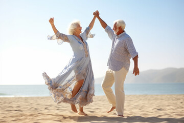 Happy senior couple dancing on the beach at the day time. Concept of active senior people