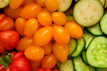 Mixed fresh vegetable background. Healthy eating ingredients. Slice of mix veggies, tomatoes, cucumbers, cherry tomato, eggplant. Nutrition, diet, vegan food. Assorted fruits rotating view closeup 4K