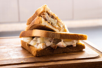 toast with sausages on a wooden background. sandwich. mini pizza.