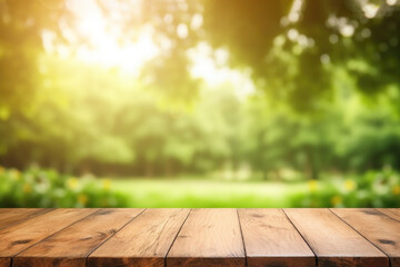 Naklejka na ściany i meble Empty wooden table in sunny park with blurred background