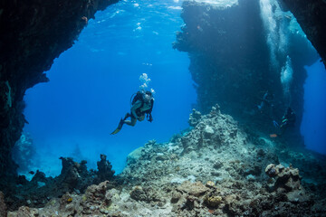 Diver explores St John's Caves in the southern Red Sea, Egypt